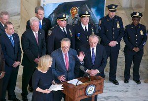 Sen. Charles Schumer, D-N.Y., flanked by Sen. Kirsten Gillibrand, D-N.Y., left, and New York Police Commissioner Bill Bratton, joined New York City firefighters and police officers, many affected by health problems from the Sept. 11, 2001 attacks during a news conference on Capitol Hill.