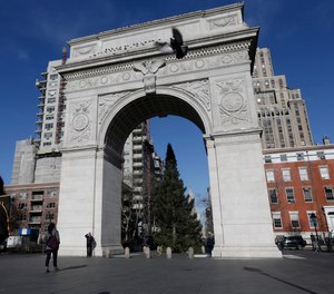 Pedestrians pass the arch in Washington Square park Thursday, Jan. 10, 2013, in New York.
