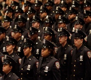 Department of Correction graduating officers participate in the Promotion and Recruit Graduation Ceremony, Friday, Feb. 13, 2015, in the Bronx borough of New York.
