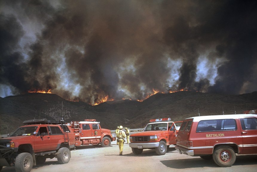 From a turnout on Interstate 5, firefighters approach a ridgeline that had erupted in flame in the Angeles National Forest about 12 miles north of Castaic, Calif., on Wednesday, August 28, 1996. 