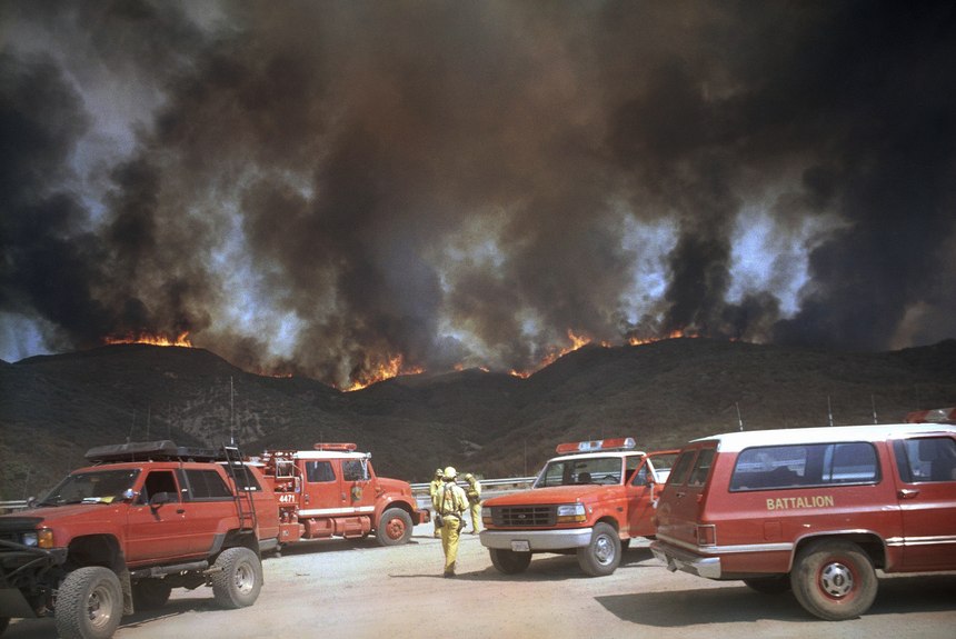 From a turnout on Interstate 5, firefighters approach a ridgeline that had erupted in flame in the Angeles National Forest about 12 miles north of Castaic, Calif., on Wednesday, August 28, 1996.