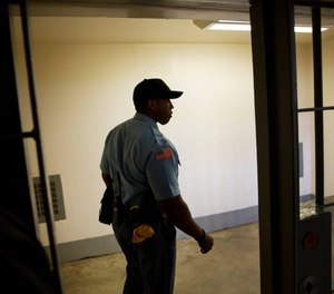 Sgt. Andrew Archie walks through death row at the Georgia Diagnostic and Classification Prison in Jackson, Ga.