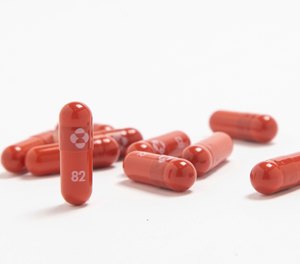 Merck says its experimental pill reduced hospitalizations and deaths and that it is seeking authorization to distribute in the U.S.