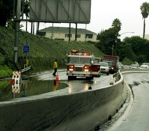 A firetruck blocks the partially flooded I-10 Highway Monday, Jan. 10, 2005, in Santa Monica, Calif.