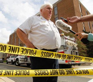 Mark Brady speaks to the media after an explosion at the University of Maryland chemistry building in 2011. The longtime spokesman of the Prince George's County Fire Department retired last week after 26 years. (AP Photo/Jose Luis Magana)