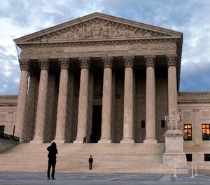 In this March 25, 2012, file photo, people visit the Supreme Court in Washington.