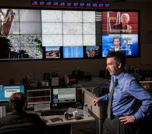 In this photo taken Friday, June 29, 2012, Jeff Brantingham, anthropology professor at the University of California Los Angeles, displays a computer generated "predictive policing," zones at the Los Angeles Police Department Unified Command Post (UCP) in Los Angeles. (AP Photo/Damian Dovarganes)