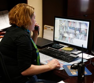 In this May 6, 2016, photo, Forest Dale Elementary School administrative assistant Heather Fellabaum tracks an