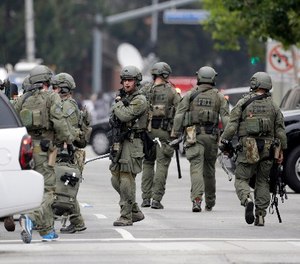 An FBI SWAT team arrives at the scene of a fatal shooting at the University of California, Los Angeles, Wednesday, June 1, 2016, in Los Angeles.