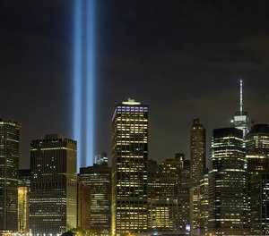 The Tribute in Light rises above the lower Manhattan skyline in New York.