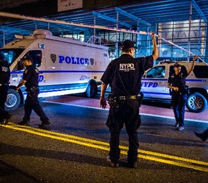 Police arrive on the scene of an explosion in Manhattan's Chelsea neighborhood, in New York, Saturday, Sept. 17, 2016. (AP Photo/Andres Kudacki)