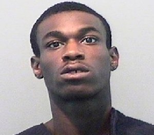 An undated booking photo provided by the Detroit Police Department shows Marquise Cromer. (Detroit Police Department via AP)