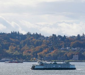 A Washington state ferry sails on Elliott Bay near West Seattle, Tuesday, Oct. 18, 2016, in Seattle.