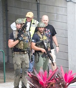 Law enforcement personnel are shown outside a garage area at Fort Lauderdale–Hollywood International Airport, Friday, Jan. 6, 2017, in Fort Lauderdale, Fla., after a shooter opened fire inside a terminal of the airport, killing several people and wounding others before being taken into custody.