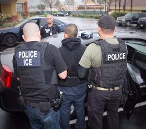 In this Tuesday, Feb. 7, 2017, photo released by U.S. Immigration and Customs Enforcement shows foreign nationals being arrested this week during a targeted enforcement operation conducted by U.S. Immigration and Customs Enforcement (ICE) aimed at immigration fugitives, re-entrants and at-large criminal aliens in Los Angeles. (Charles Reed/U.S. Immigration and Customs Enforcement via AP)