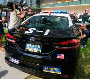 A prototype of the Ford Fusion police hybrid car is pictured at LAPD headquarters. The U.S. Department of Energy has funding options for PDs considering adding alternative-fuel vehicles to their fleet.