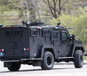 An armor police vehicle drives through Fairmount park in Philadelphia, Monday, April 17, 2017.