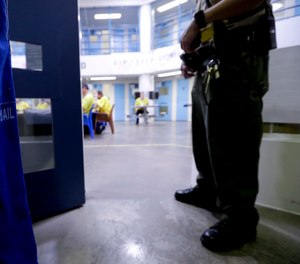 A Sheriff officer watches over inmates Thursday, April 27, 2017.