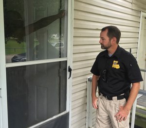 In this June 20, 2017 photo, Scott Tubbs checks in on one of the 140 cases he handles in Baton Rouge, La. Tubbs is the Baton Rouge probation and parole office's lone mental health specialist.