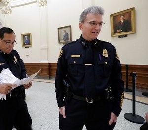 Houston Police Chief Art Acevedo, left, and San Antonio Police Chief William McManus, right, stand in the rotunda at the Texas CapitolTuesday, July 25, 2017, in Austin, Texas. (AP Photo/Eric Gay)