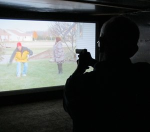 A firearms training simulator at the Clark County Fair on Wednesday, July 26, 2017, in Springfield, Ohio. The county sheriff rented the simulator to help the public better understand how quickly officers must decide whether to use lethal force.