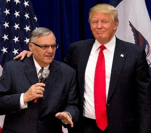 In this Jan. 26, 2016 file photo, then-Republican presidential candidate Donald Trump is joined by Joe Arpaio, the sheriff of metro Phoenix, at a campaign event in Marshalltown, Iowa.