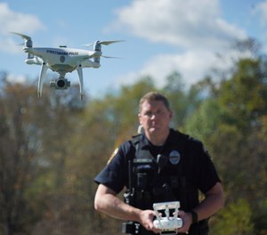 In this Oct. 16, 2017 photo, Streetsboro Officer Scott Hermon pilots the department's first drone in Streetsboro, Ohio.
