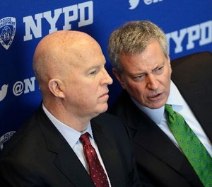 New York City Mayor Bill de Blasio, right, talks with New York City Police Commissioner James O'Neill at a plaque dedication ceremony at the Central Park police precinct in New York, Wednesday, Jan. 10, 2018. (AP Photo/Seth Wenig)