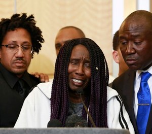 Sequita Thompson, center, discusses the shooting of her grandson, Stephon Clark, during a news conference, Monday, March 26, 2018, in Sacramento, Calif.