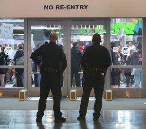 Protesters calling for justice in the name of Stephon Clark block the entrance to the Golden One Center preventing fans from entering the arena to watch the Sacramento Kings take on the Dallas Mavericks NBA basketball game in Sacramento, Calif., Tuesday, March 27, 2018. (AP Photo/Steve Yeater)