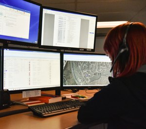 A dispatcher in Roswell, Ga., works with a variety of screens while handling a 911 call. The Roswell call center is one of the few in the United States that accepts text messages.