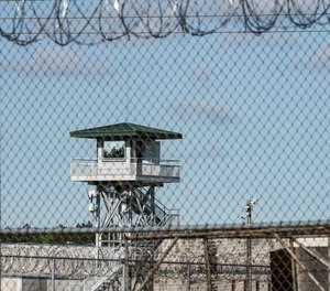 In this April 16, 2018, file photo, a guard tower stands above the Lee Correctional Institution, a maximum security prison in Bishopville, S.C., where a number of South Carolina corrections employees faced federal charges related to bribery and bringing contraband into the state's institutions a week after a deadly riot.