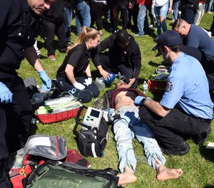 An unconscious man is attended to by paramedics San Francisco, Calif., on Friday, April 20, 2018.