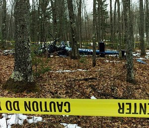 This image provided by the Oneida County Sheriff's Office in Rhinelander, Wis., shows the wreckage of the medical helicopter.