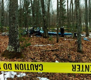 This image shows the wreckage of the Air Methods helicopter that crashed in Hazelhurst, Wis. in 2018.