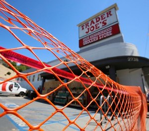 Access is blocked to a Trader Joe's grocery store in the Los Feliz neighborhood of Los Angeles, Sunday, July 22, 2018. (AP Photo/Damian Dovarganes)