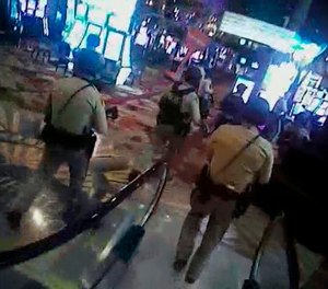 In this Oct. 1, 2017, image taken from body-camera video provided by the Las Vegas Metropolitan Police Department, officers search Las Vegas Strip casinos following a shooting that killed 58 people and injured more than 800 in Las Vegas. (Las Vegas Metropolitan Police Department via AP)