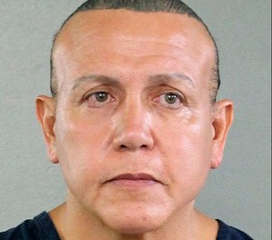 In this undated photo released by the Broward County Sheriff's office, Cesar Sayoc is seen in a booking photo, in Miami. Federal authorities took Sayoc, 56, of Aventura, Fla., into custody Friday, Oct. 26, 2018 in Florida in connection with the mail-bomb scare that earlier widened to 12 suspicious packages, the FBI and Justice Department said. (Broward County Sheriff's Office via AP)