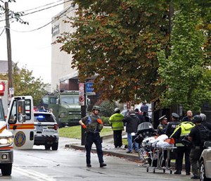 First responders surround the Tree of Life Synagogue in Pittsburgh, Pa., where a shooter opened fire Saturday, Oct. 27, 2018. (AP Photo/Gene J. Puskar)