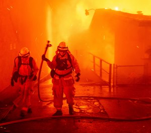 Firefighters battle the Camp Fire as it tears through Paradise, Calif., on Thursday, Nov. 8, 2018.