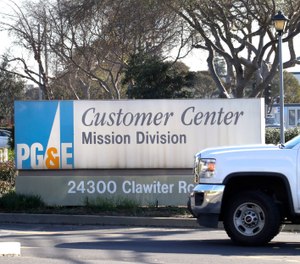 In this photo taken on Wednesday, Jan. 23, 2019, a Pacific Gas & Electric truck enters their customer center in Hayward, Calif. (AP Photo/Ben Margot)