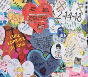 A memorial at the Marjory Stoneman Douglas High School where 14 students and three staff members were killed during a mass shooting.