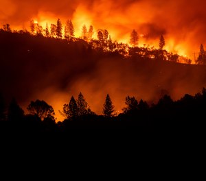 In this Nov. 10, 2018, file photo, the Camp Fire burns along a ridge top near Big Bend, Calif. California fire officials want to dramatically increase the removal of dead trees and other forest management practices to reduce fuel for wildfires and are calling on the National Guard to help with the effort. (AP Photo/Noah Berger, File)