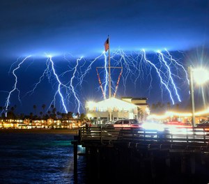 This time exposure photo provided by the Santa Barbara County Fire Department shows a series of lightning strikes over Santa Barbara, Calif., seen from Stearns Wharf in the city's harbor, Tuesday evening, March 5, 2019. A storm soaking California on Wednesday could trigger mudslides in wildfire burn areas where thousands of residents are under evacuation orders, authorities warned. (Mike Eliason/Santa Barbara County Fire Department via AP)