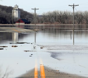 The Missouri River floods across and closes K-7 highway near White Cloud, Kan., Monday, March 18, 2019. (AP Photo/Orlin Wagner)