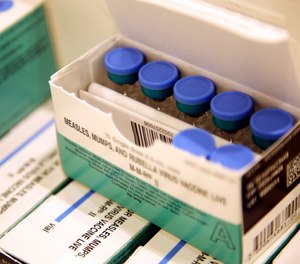 In this March 27, 2019, file photo, measles, mumps and rubella vaccines sit in a cooler at the Rockland County Health Department in Pomona, N.Y. (AP Photo/Seth Wenig, File)