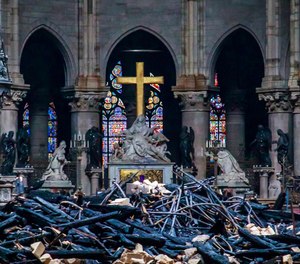 Debris are seen inside Notre Dame cathedral in Paris, Tuesday, April 16, 2019. Firefighters declared success Tuesday in a more than 12-hour battle to extinguish an inferno engulfing Paris' iconic Notre Dame cathedral that claimed its spire and roof, but spared its bell towers and the purported Crown of Christ.