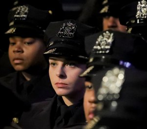 New York City Police Academy graduates listen during their graduation ceremony, adding 457 new members of the NYPD, Thursday April 18, 2019, in New York.
