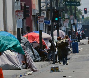 Tents housing homeless line a street down the street from LAPD Central Community Police Station in downtown Los Angeles on Thursday, May 30, 2019. (AP Photo/Richard Vogel)