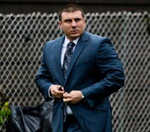 In this May 13, 2019, file photo, New York City police officer Daniel Pantaleo leaves his house in Staten Island, N.Y. (AP Photo/Eduardo Munoz Alvarez, File)